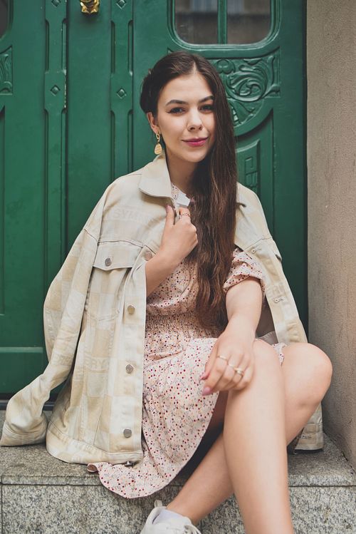 Cinematic portrait of a woman in Poznań, minimal composition and natural expression