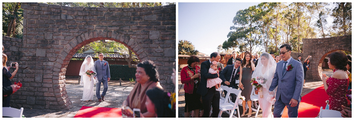 An emotional bride's walking down the aisle at Japanese Garden Auburn Botanic Gardens.