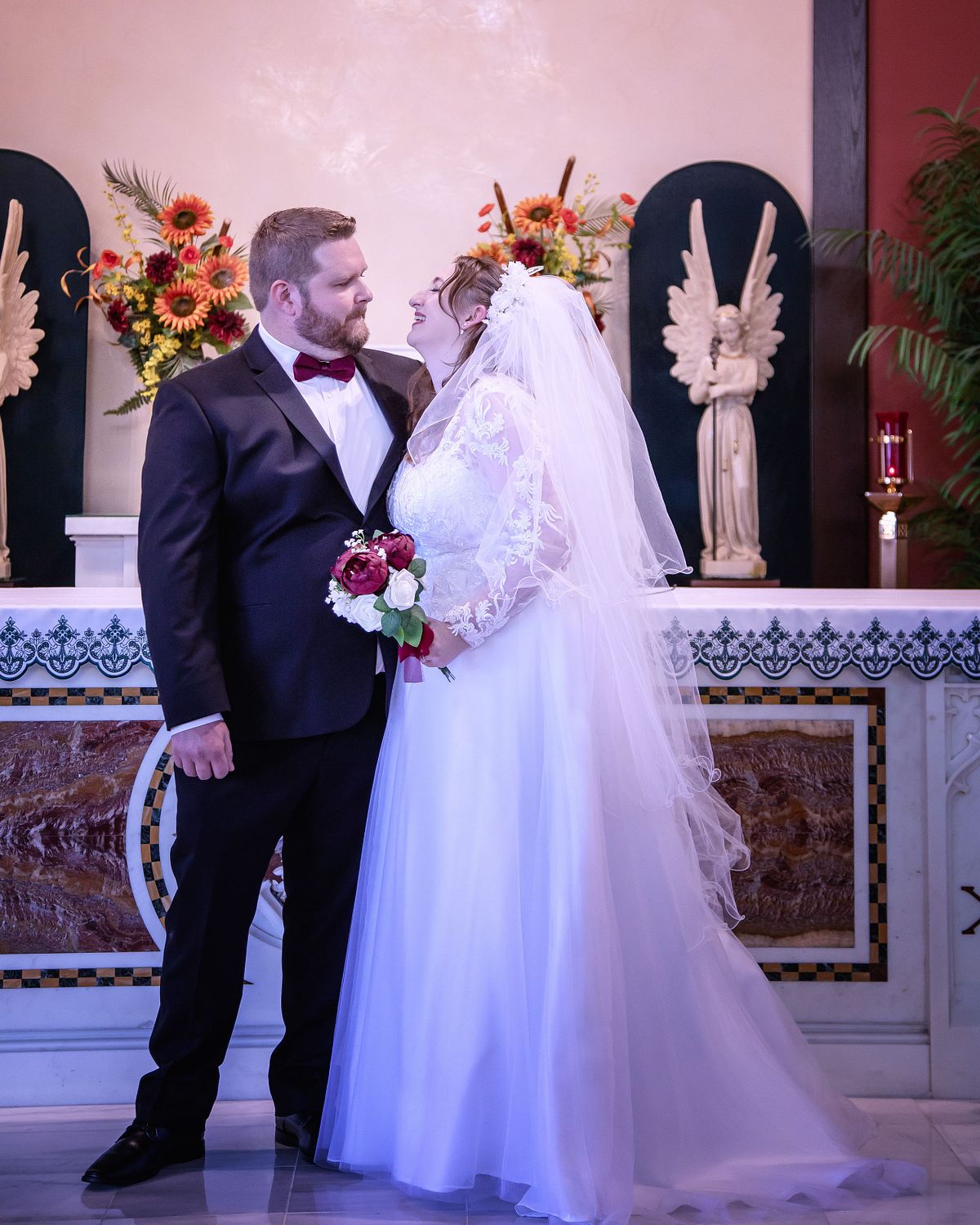 bride and groom in front of altar at st. lukes, lewes, delaware captured by eastern shore wedding photographer