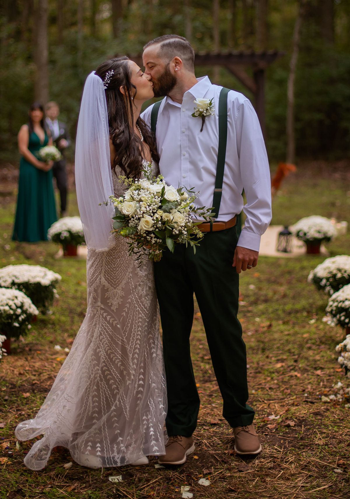 Jana and jake posing in the aisle after the wedding ceremony during autumn forest wedding
