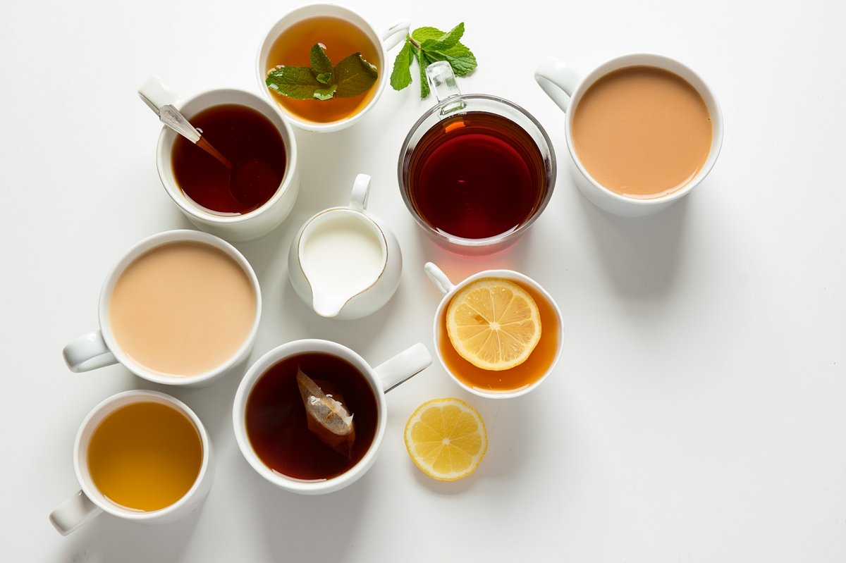 Various cups of tea with different garnishes