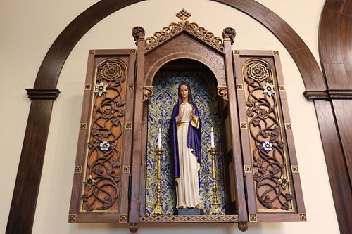 fully restored statue of the Blessed Mother in a walnut and cherry shrine with hand-carved vines and flowers at St. Bernadette Catholic Church in Lancaster, Ohio