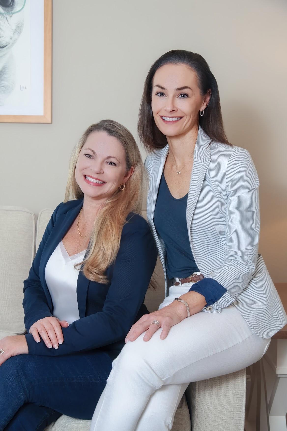 Publisher and Editor of a St. Augustine Magazine posing together on a couch during their branding headshot session.